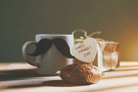 Happy  fathers day with heart and coffee cup on woodの写真素材