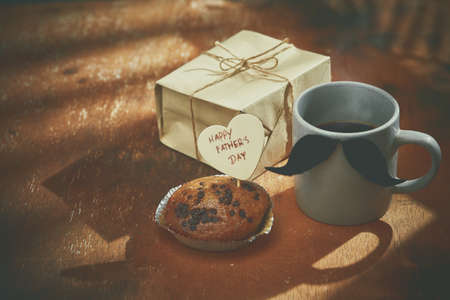 Happy  fathers day with heart and coffee cup on woodの写真素材