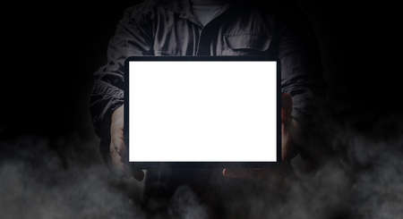 Man holding a tablet isolated on whiteの写真素材