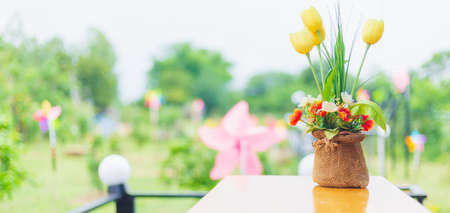Mixed flowers on bouquet with garden backgroundの写真素材