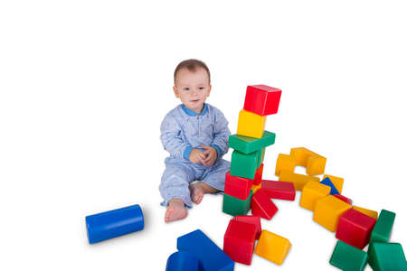 child playing with colored plastic bricks  and cubesの写真素材