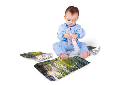 child tearing the paper calendarの写真素材