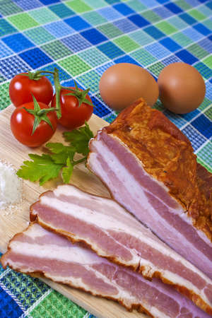 Breakfast - Chopped Bacon, Cherry Tomatoes and Eggs on the Tableの写真素材