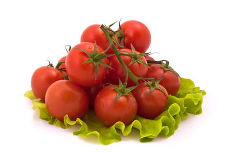 Cherry Tomatoes on Salad Leaves Isolated on White Backgroundの写真素材