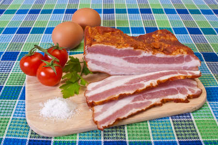 Breakfast - Chopped Bacon, Cherry Tomatoes and Eggs on the Tableの写真素材
