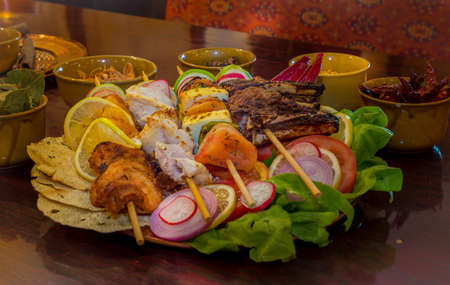 Grilled meat cooked in Indian style in a Tandoor