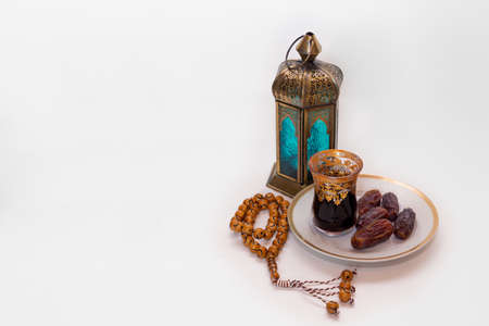 Decoration for the holi month of Ramadan with lamps, tasbih, dates and kawa - a traditional Arabic teaDecoration for the holi month of Ramadan with lamps, tasbih, dates and kawa - a traditional Arabic teaの写真素材