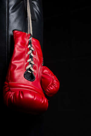 Red boxing gloves with low key lightingの写真素材