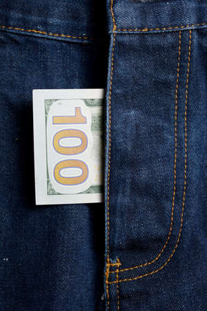 Money series : Hundred banknote poking out of denim zipperの写真素材