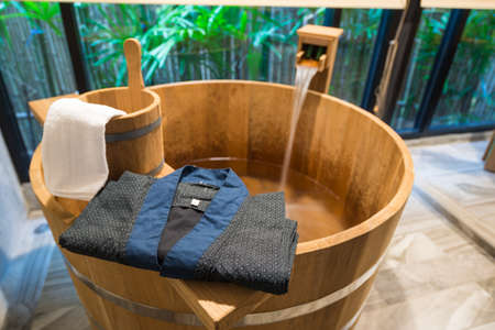Onsen series : Blue yukata on wooden bathtubの写真素材