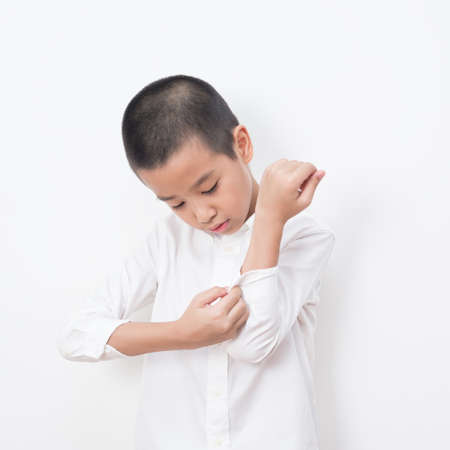 Asian family series : Asian boy dressing in studioの写真素材