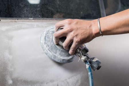 Auto body repair series : Sanding door paintの写真素材