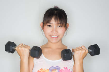 Exercise series : Asian woman exercisingの写真素材
