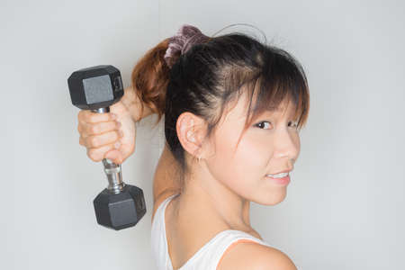 Exercise series : Asian woman exercisingの写真素材