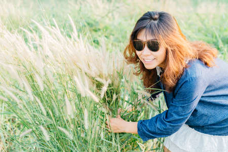 Life style series : Asian woman in grass field