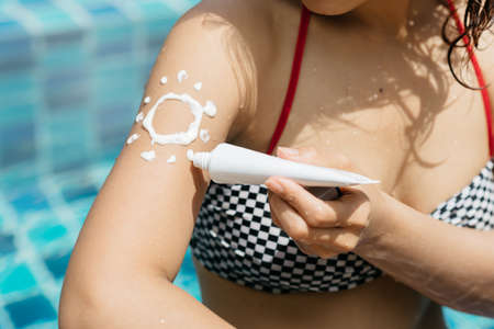 Swimming pool series : Applying sunscreen in swimming pool