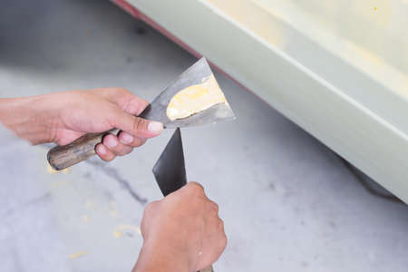 Auto body repair series : Working on puttyの写真素材