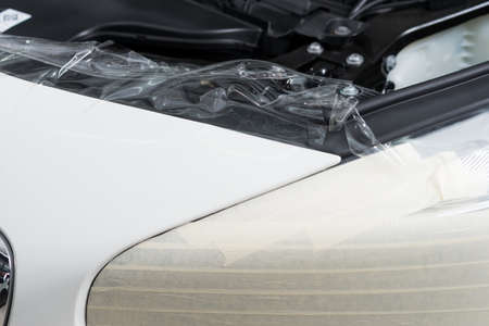Paint protection film series : Installing paint protection film on white carの写真素材