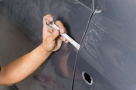 Auto body repair series : Fixing car bodyの写真素材
