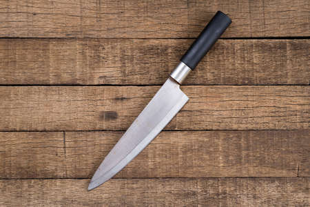Food series : Knife on wooden plank background