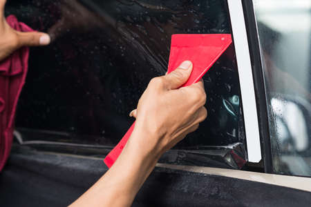 Car window tinting series : Installing car window tintの写真素材