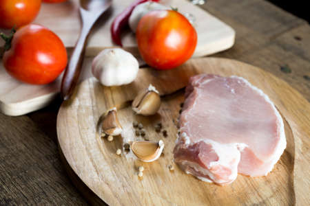 Food series : Raw pork on wooden cutting boardの写真素材