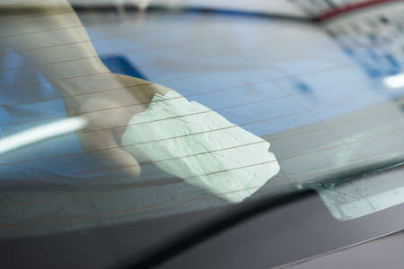 Car window tinting series : Cleaning window filmの写真素材
