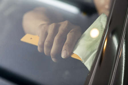 Car window tinting series : Installing car window tintの写真素材