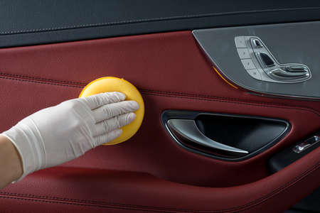 Car detailing series : Cleaning car door panelの写真素材