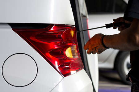 Auto body repair series: Reassemble white car taillightsの写真素材