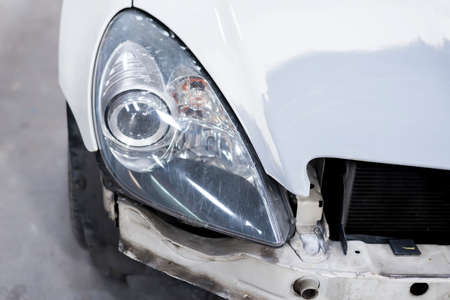 Auto body repair series: Closeup of white sport car waiting for repaint