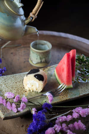 Food series: Cake roll with watermelon and hot teaの写真素材