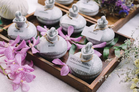 Massage series: Massage amenity kit, ceramic container in wooden trayの写真素材