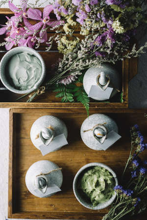 Massage series: Massage amenity kit, ceramic container in wooden trayの写真素材