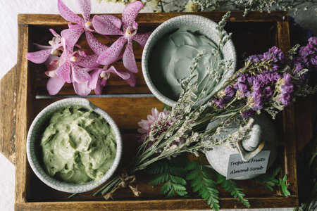 Massage series: Massage amenity kit, ceramic container in wooden trayの写真素材