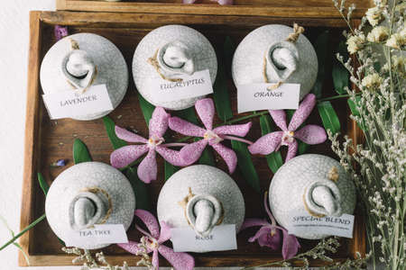 Massage series: Massage amenity kit, ceramic container in wooden trayの写真素材