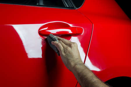 Car detailing series: Cleaning red carの写真素材
