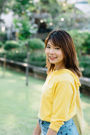 Lifestyle series: Young Asian woman in summer parkの写真素材