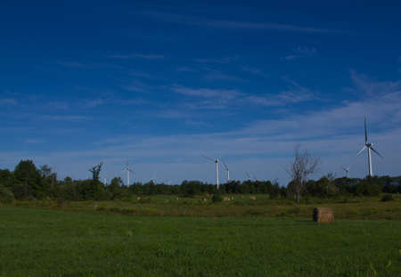 Wind turbines across farn fields