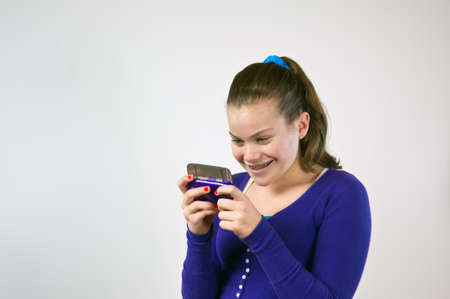 Young teen girl textingの写真素材