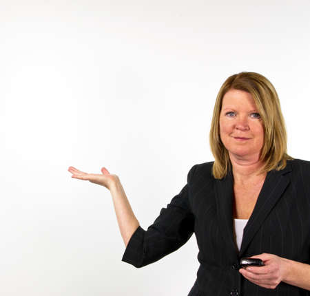 Blond business woman against white backgroundの写真素材