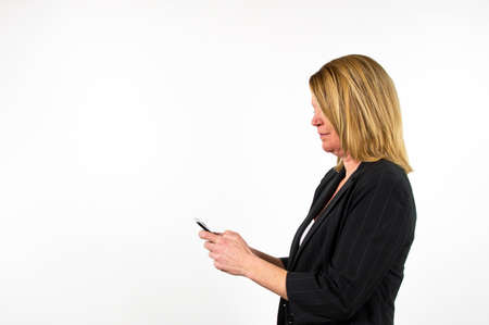 Blond business woman against white backgroundの写真素材