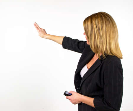 Blond business woman against white backgroundの写真素材