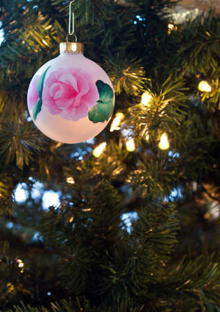 closeup of a single ornament hanging on a Christmas treeの写真素材