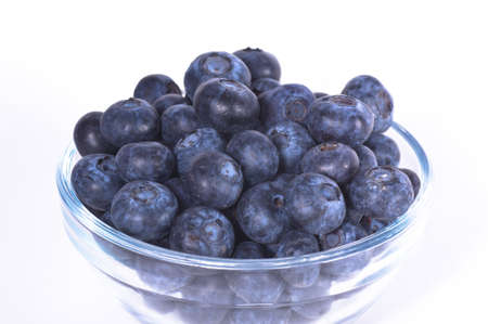 Closeup of fresh blueberries isolated on a white backgroundの写真素材