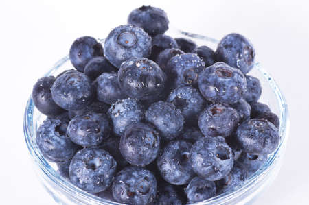 Closeup of fresh blueberries isolated on a white backgroundの写真素材