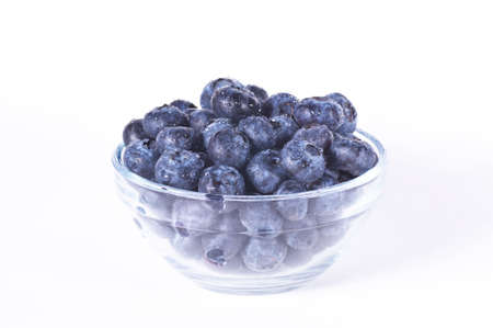 Closeup of fresh blueberries isolated on a white backgroundの写真素材