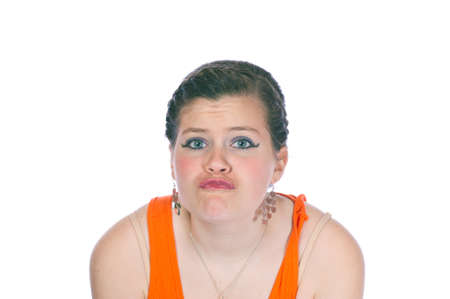 Teen girl making faces white backgroundの写真素材