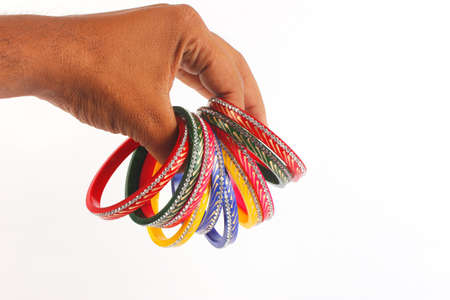 colorful indian bangles isolated on whiteの写真素材