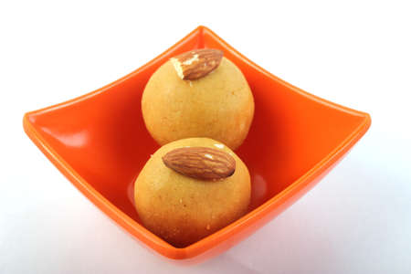 Laddu  Indian Sweet In Melamine Bowl  Isolated on Whiteの写真素材